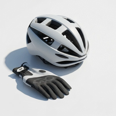 Modern aerodynamic road cycling helmet and professional cycling gloves on a clean surface